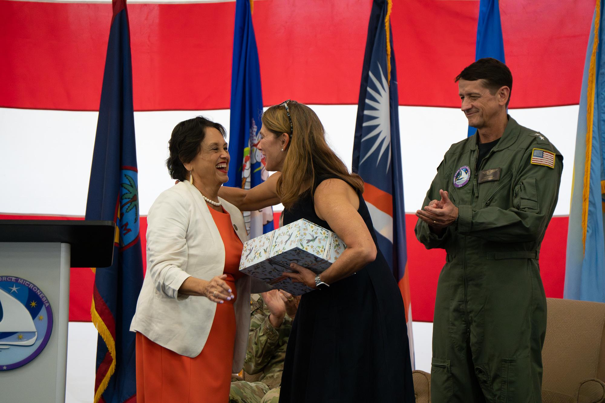 Leon Guerrero presented a gift to Huffman&#039;s wife, Judy, at the change of command ceremony. Photo by Skyler Obispo