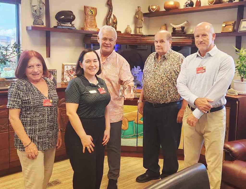 (From left) Maratita, Leon Guerrero, Leonard K. Kaae, senior vice president and general manager, and Mark J. Manczarz, vice president of finance and secretary/treasurer, both with Black Construction Corp; and John.