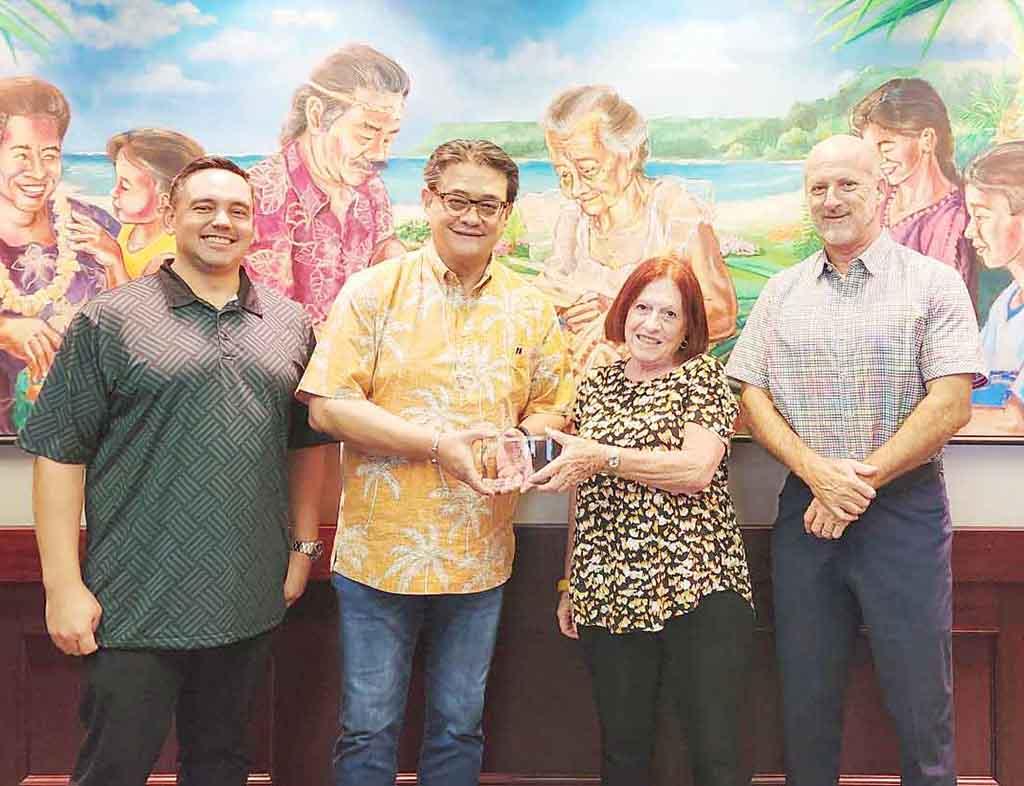 (From left) Cook; Edward G. Untalan, executive vice president and regional manager, First Hawaiian Bank; Maratita; and John.