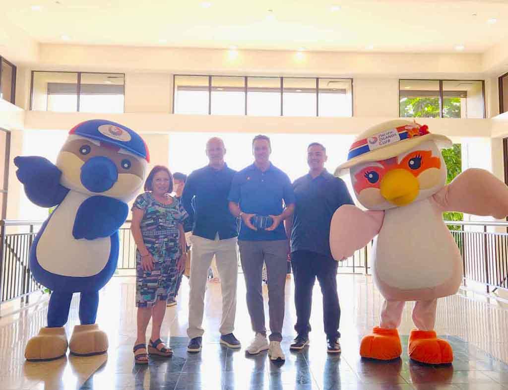 Pacific Islands Club Guam Mascot Siheki; Maratita; John; Benjamin H. Ferguson, general manager, Pacific Islands Club; Cook; and Sandy, PIC Guam Mascot.
